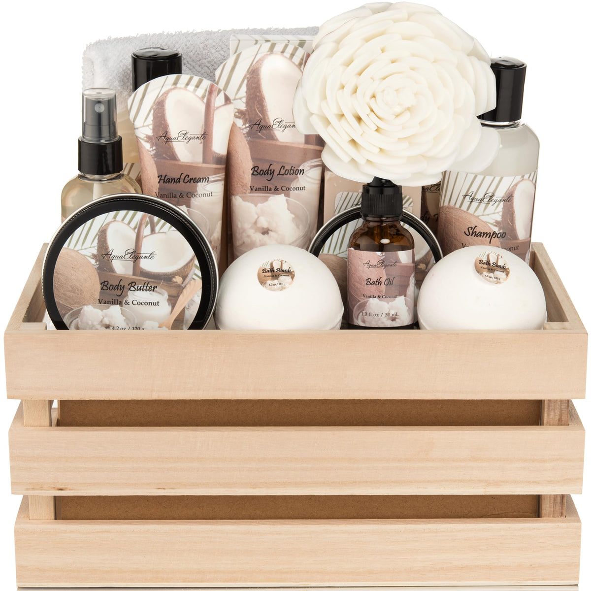 Set of beauty products including bottles, a bowl, and a flower in a wooden crate.