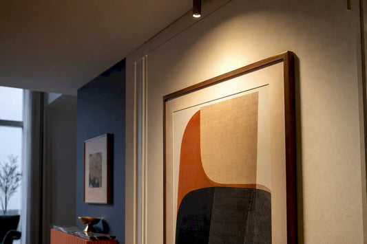 Artwork illuminated by a focused home accent light