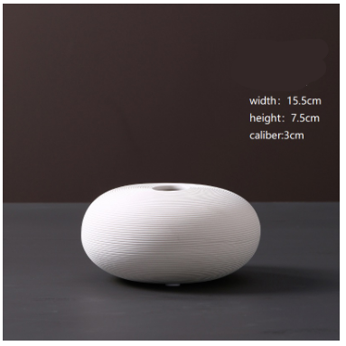 Shop modern minimalist ceramic flower ornaments in pristine white. Ideal for flower arrangements, and home décor in living rooms, bedrooms, and offices.