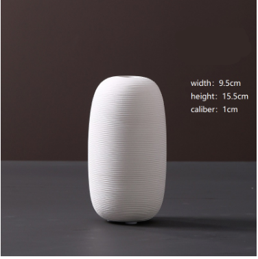White ceramic vase on a dark background with measurements displayed.