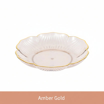 White floral-patterned dish with gold rim on a white background