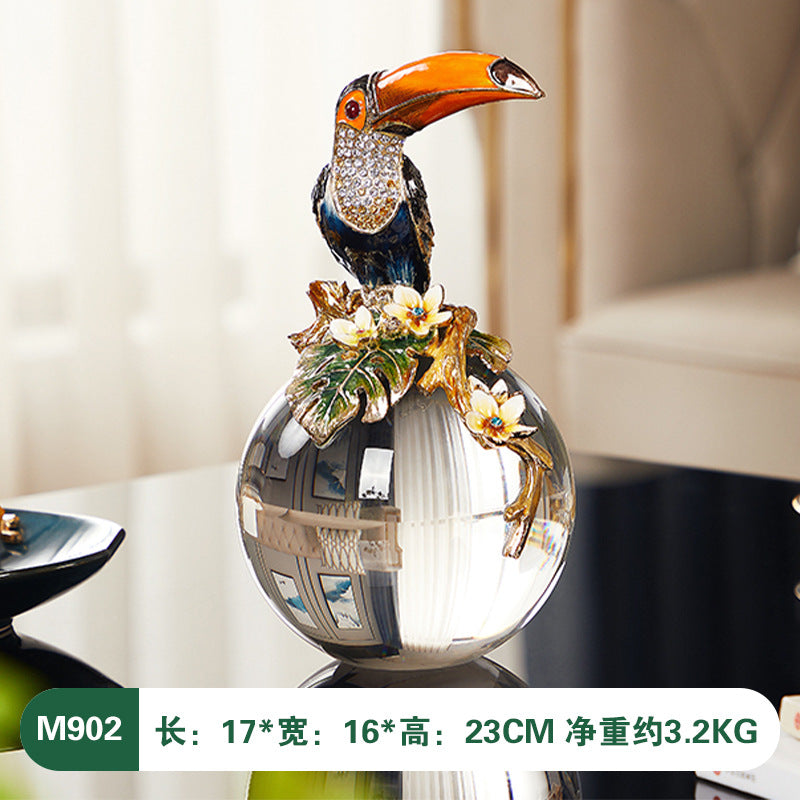 Decorative vase with a toucan design on a blurred background