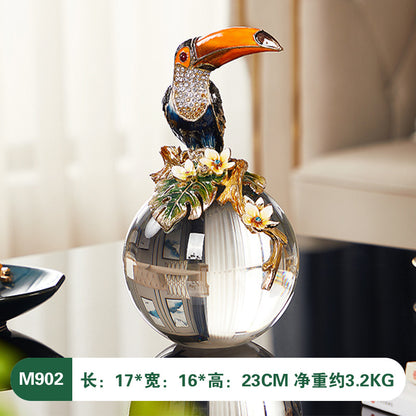 Decorative vase with a toucan design on a blurred background