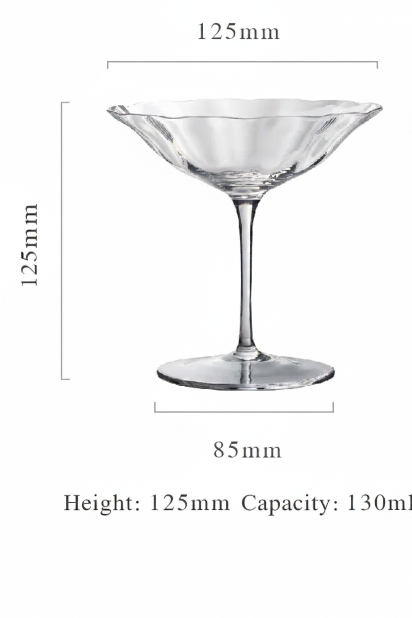 Clear glass cocktail glass with dimensions on a white background