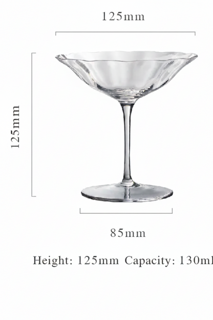 Clear glass cocktail glass with dimensions on a white background