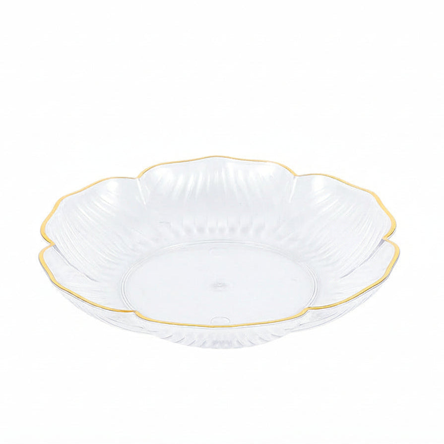 White glass bowl with gold rim on a white background
