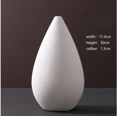 White teardrop-shaped vase on a dark background with measurements displayed.
