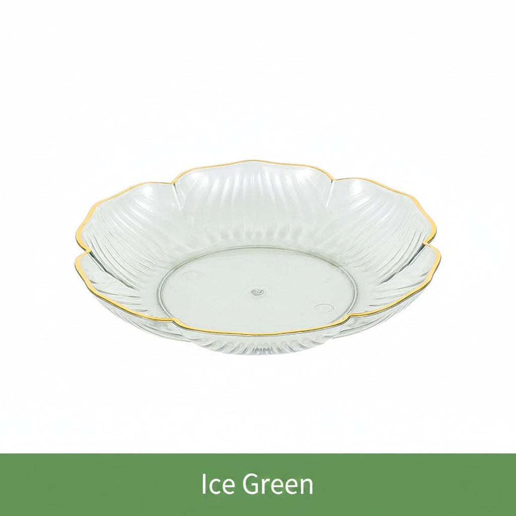 Decorative glass bowl with gold rim on a white background