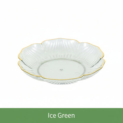 Decorative glass bowl with gold rim on a white background